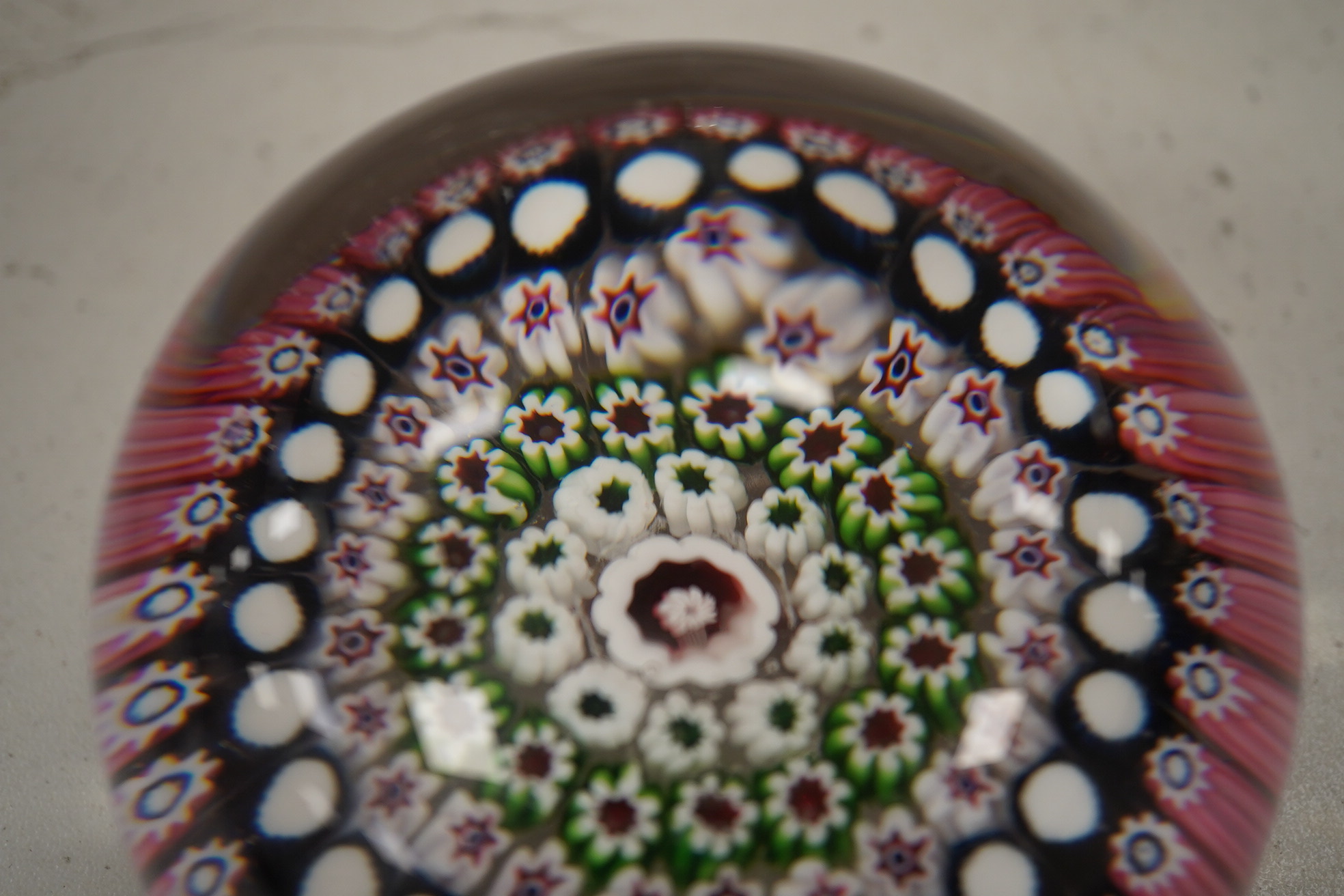 Two Victorian English millefiori glass paperweights, 7cm tall. Condition - fair to good